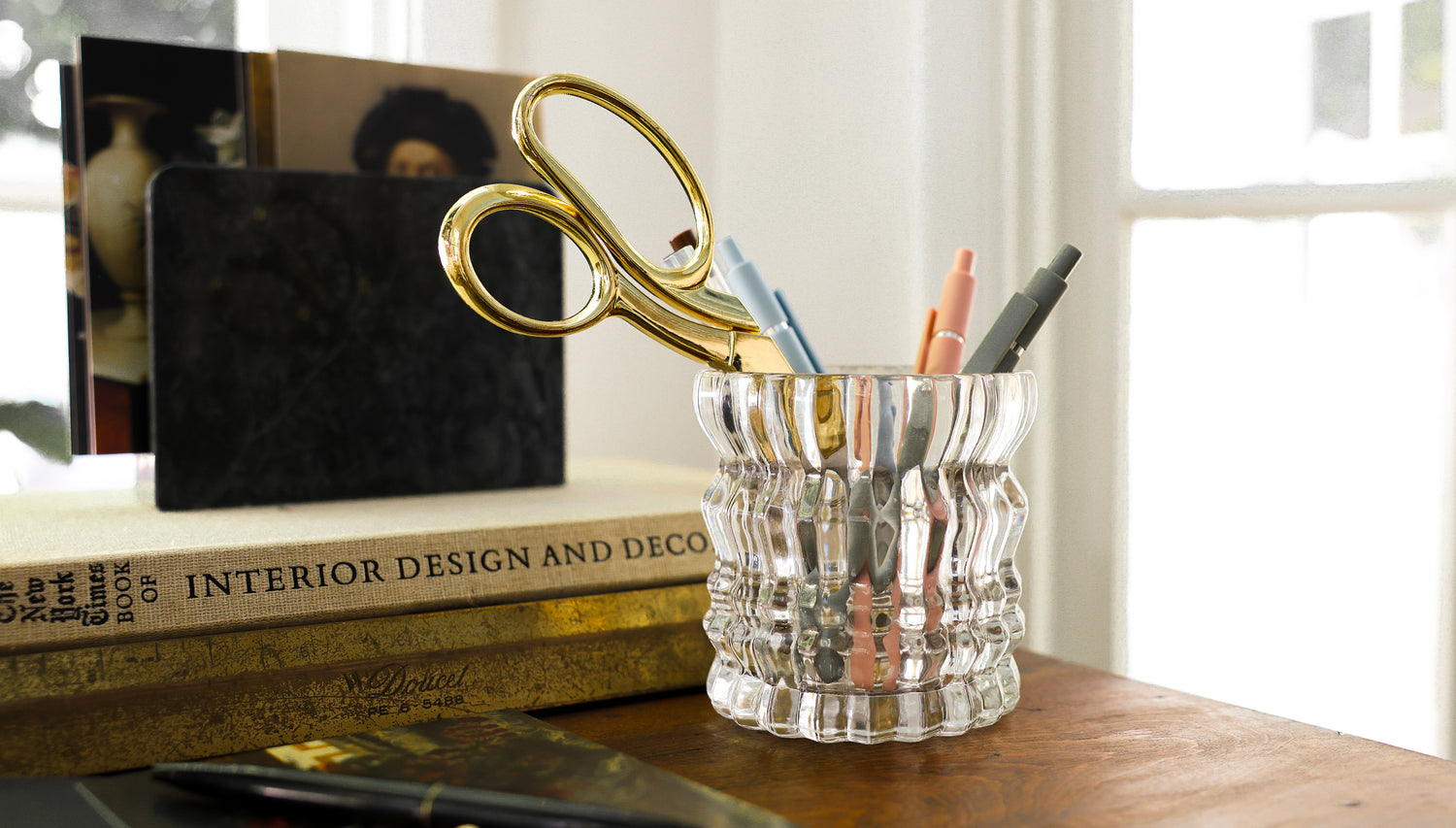 The Arlow candle is repurposed, now holding pens and pencils.