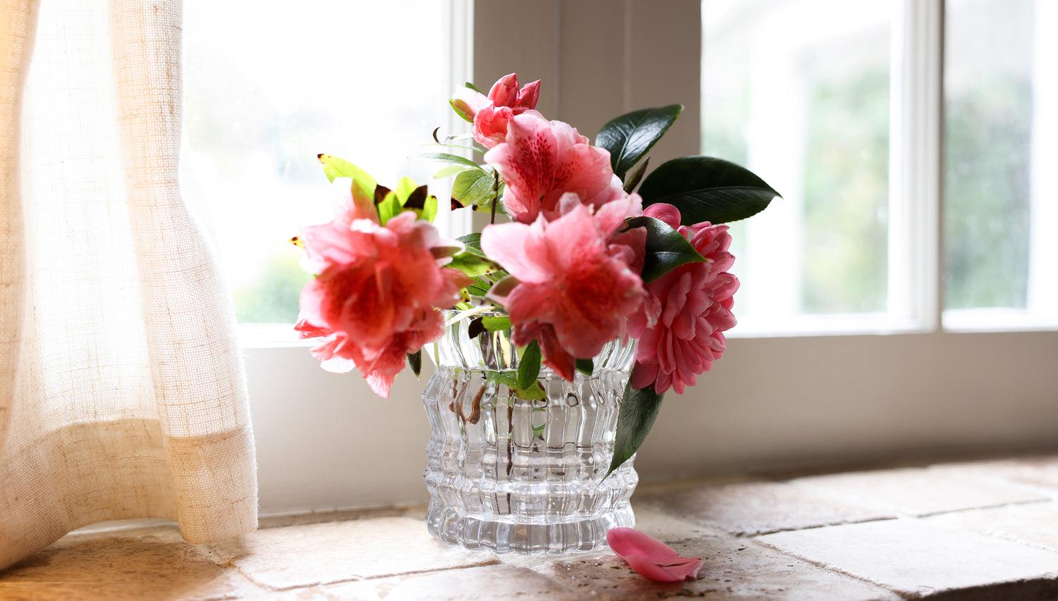 The Arlow candle vase is repurposed, now beautifully holding a bouquet of flowers.