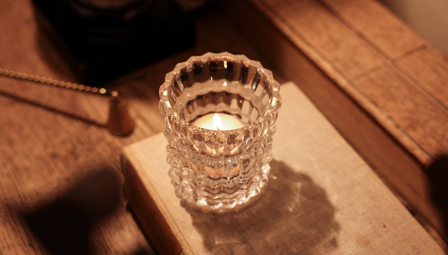 The Arlow candle is repurposed, now housing a smaller tea light inside.