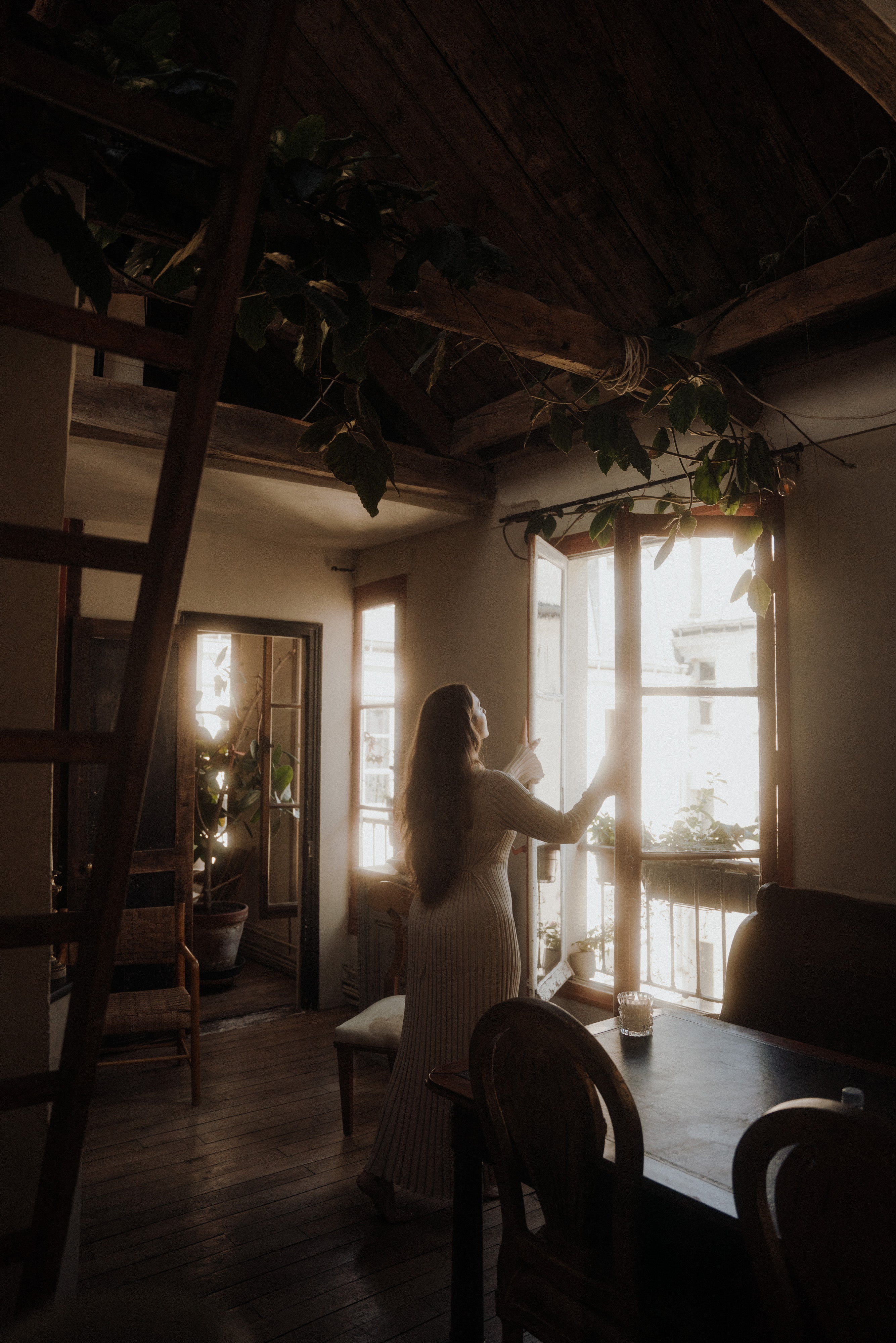 MaCenna Lee opens the doors of a house, breathing in the fresh air as the Arlow candle flickers softly on the table beside her.